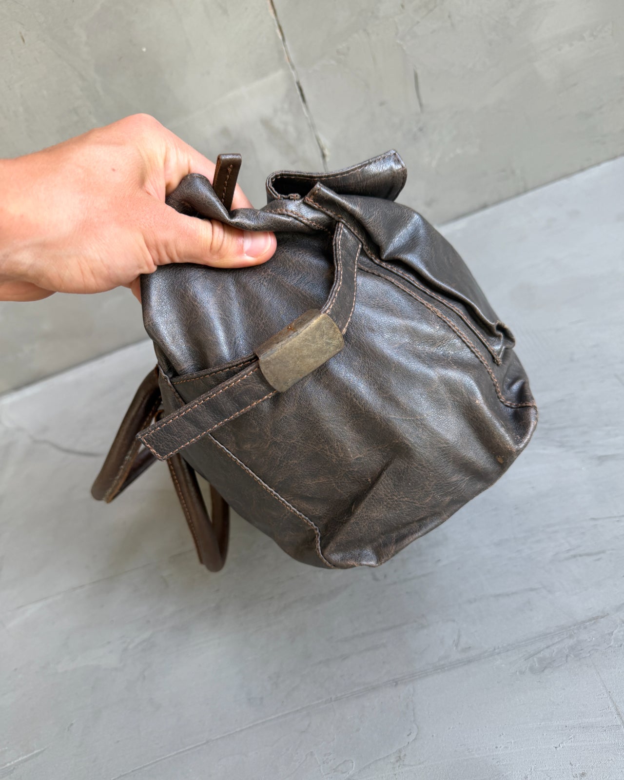 Armani Jeans Brown Leather Handbag-on a concrete background