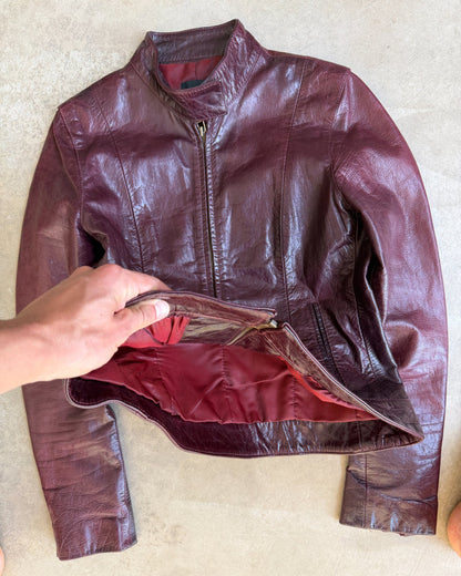 Transmission New York Oxblood Red Leather Jacket – L-on a concrete background