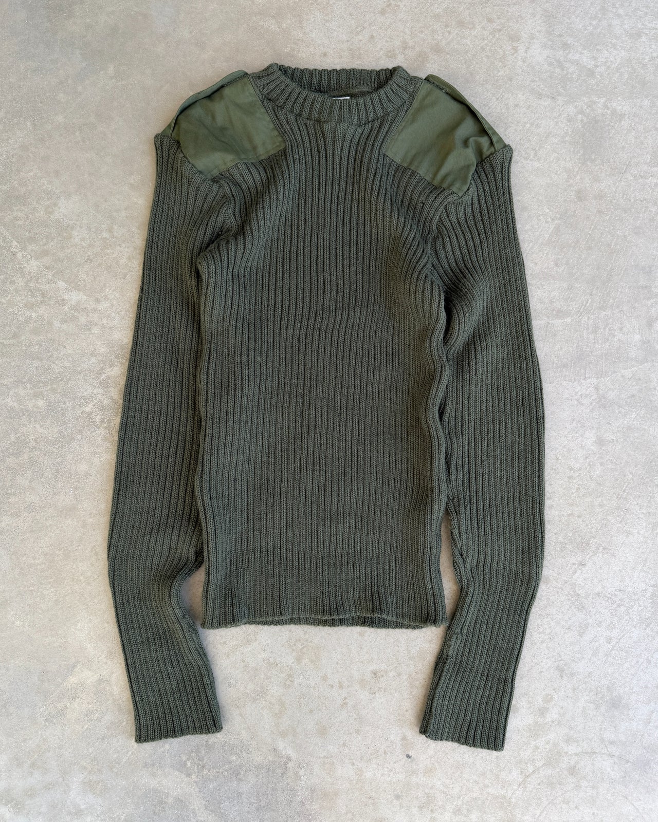 RAF Military Green Knit Sweatshirt – M-on a concrete background