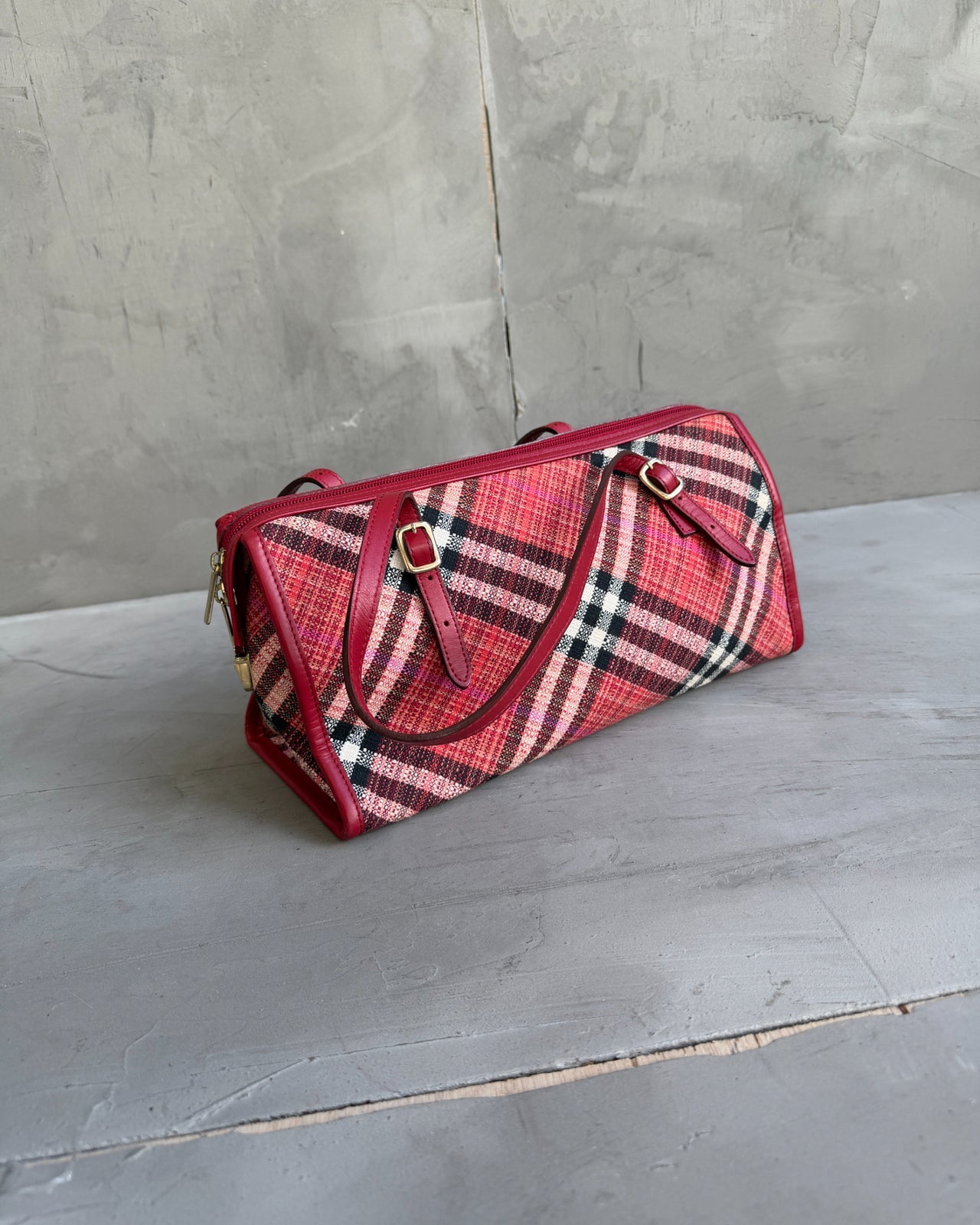 Burberry Blue Label Nova Print Red Bag-on a concrete background