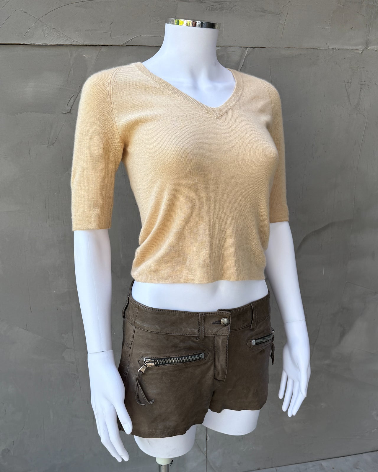 Prada Cashmere Silk Blend V Neck T-Shirt – S-on a concrete background