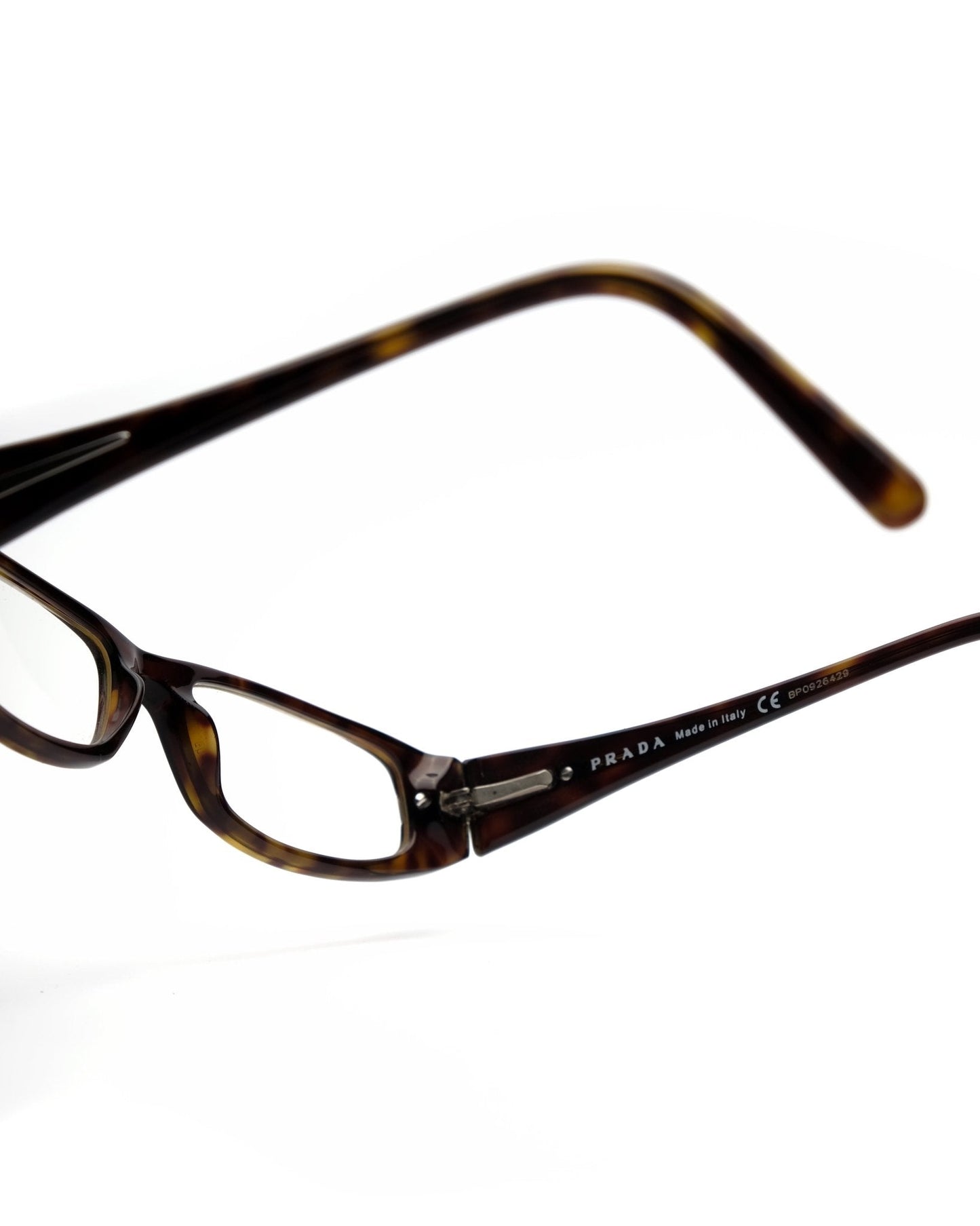 https://cdn.shopify.com/s/files/1/0818/5459/5398/files/prada-prada-fall-2006-optical-frame-vintage-su544-7037415.jpg?v=1784368364