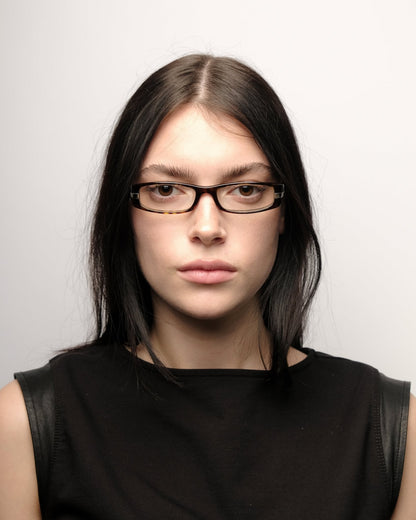 https://cdn.shopify.com/s/files/1/0818/5459/5398/files/prada-prada-fall-2006-optical-frame-vintage-su544-9572716.jpg?v=1784368362