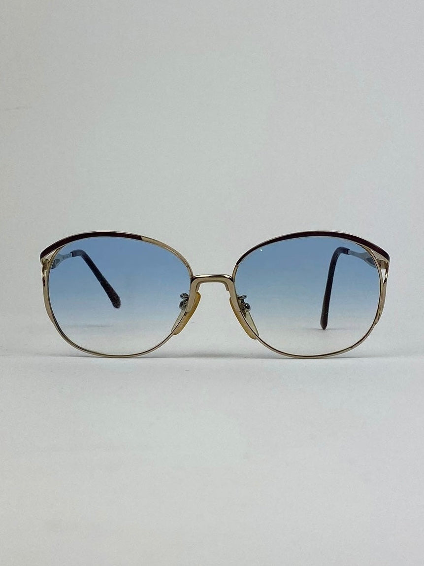 Yves Saint Laurent Paris round gold sunglasses with sleek metal frames and tinted lenses, stylish and fashionable eyewear.