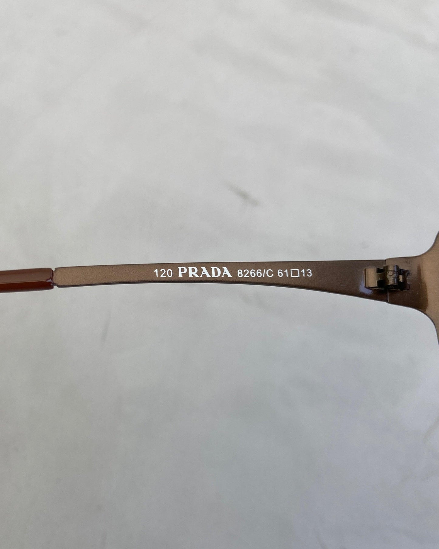 PRADA 90'S RIMLESS WRAP AROUND BROWN SUNGLASSES - Known Source