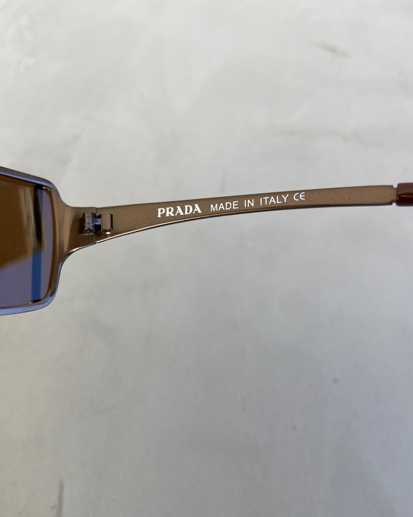 PRADA 90'S RIMLESS WRAP AROUND BROWN SUNGLASSES - Known Source