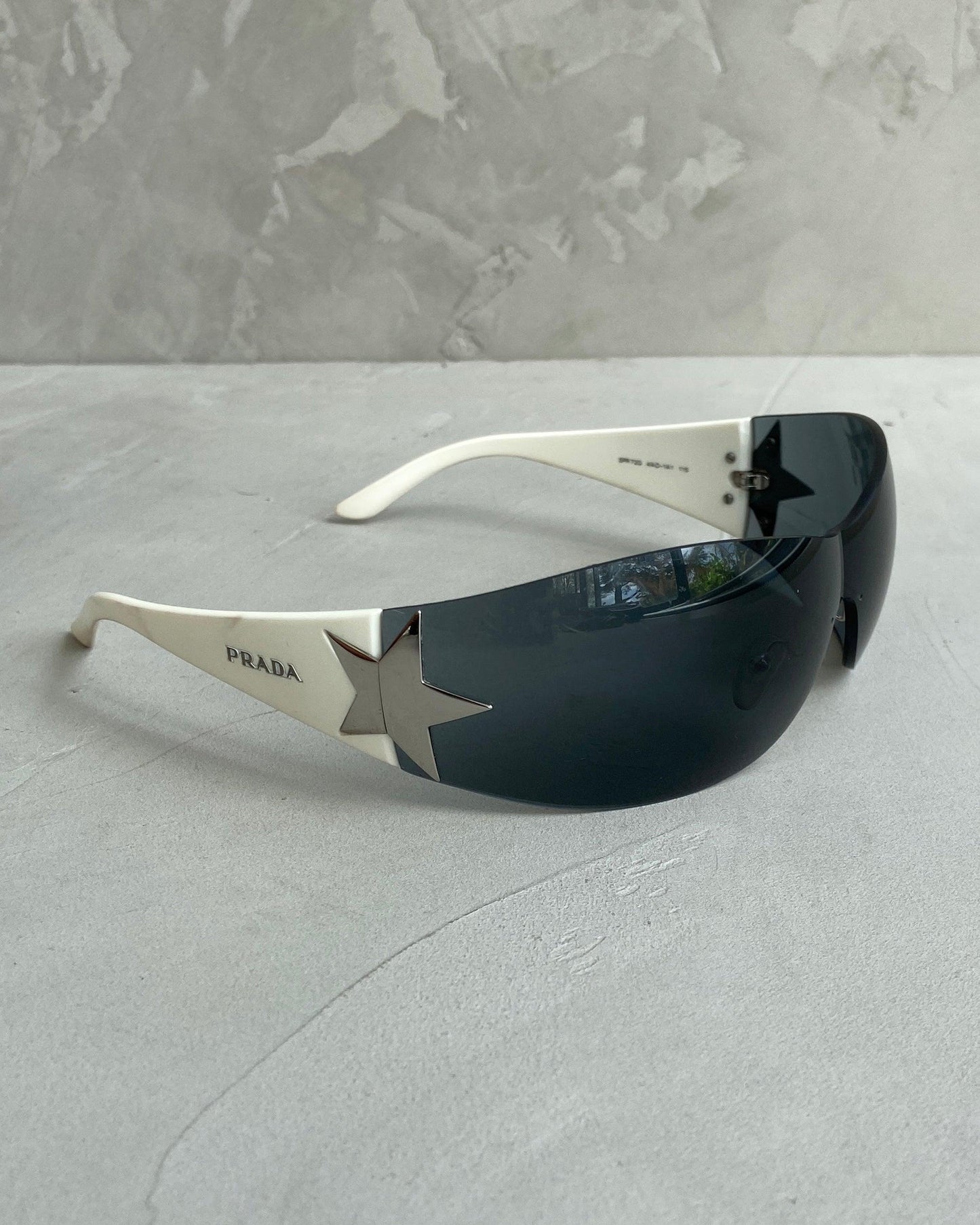 PRADA WRAP AROUND STAR SUNGLASSES - Known Source