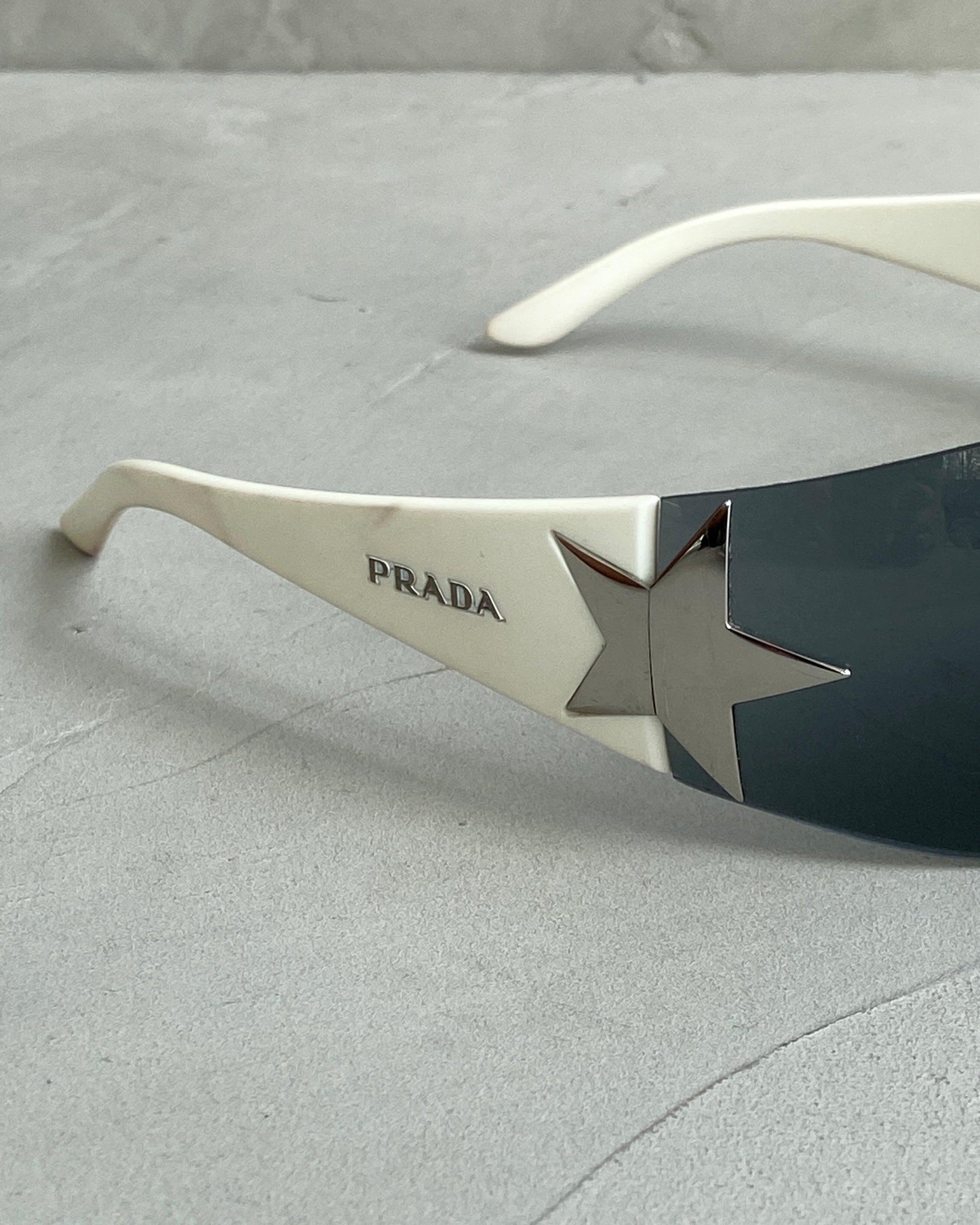 PRADA WRAP AROUND STAR SUNGLASSES - Known Source