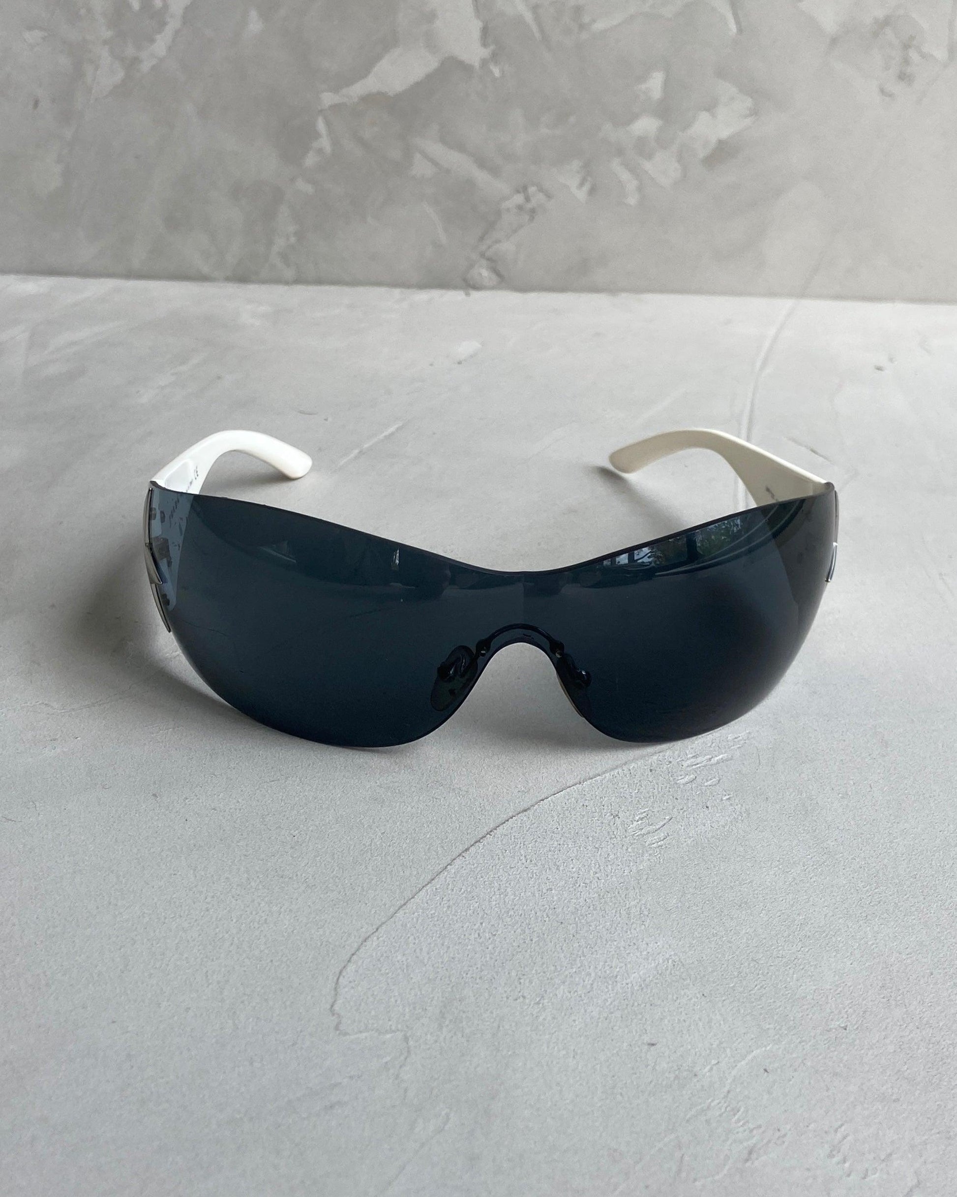 PRADA WRAP AROUND STAR SUNGLASSES - Known Source