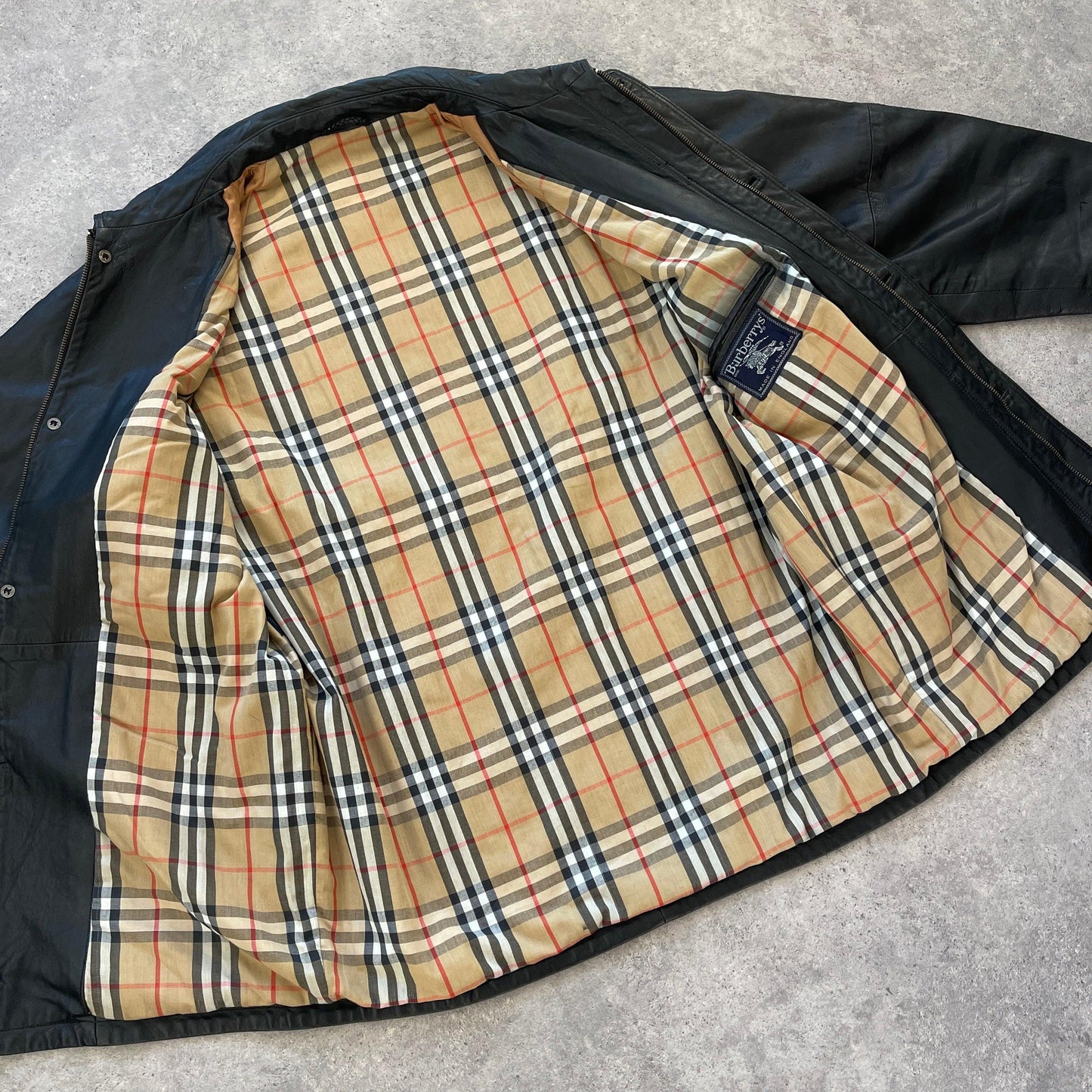 Burberry’s 1990s heavyweight nova check leather jacket (XL) - Known Source