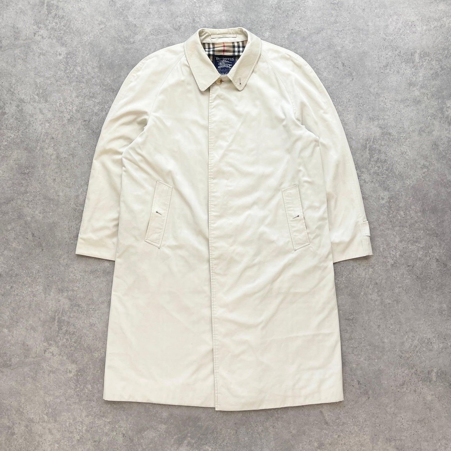 Burberry’s 1990s nova check cream trench jacket (L) - Known Source