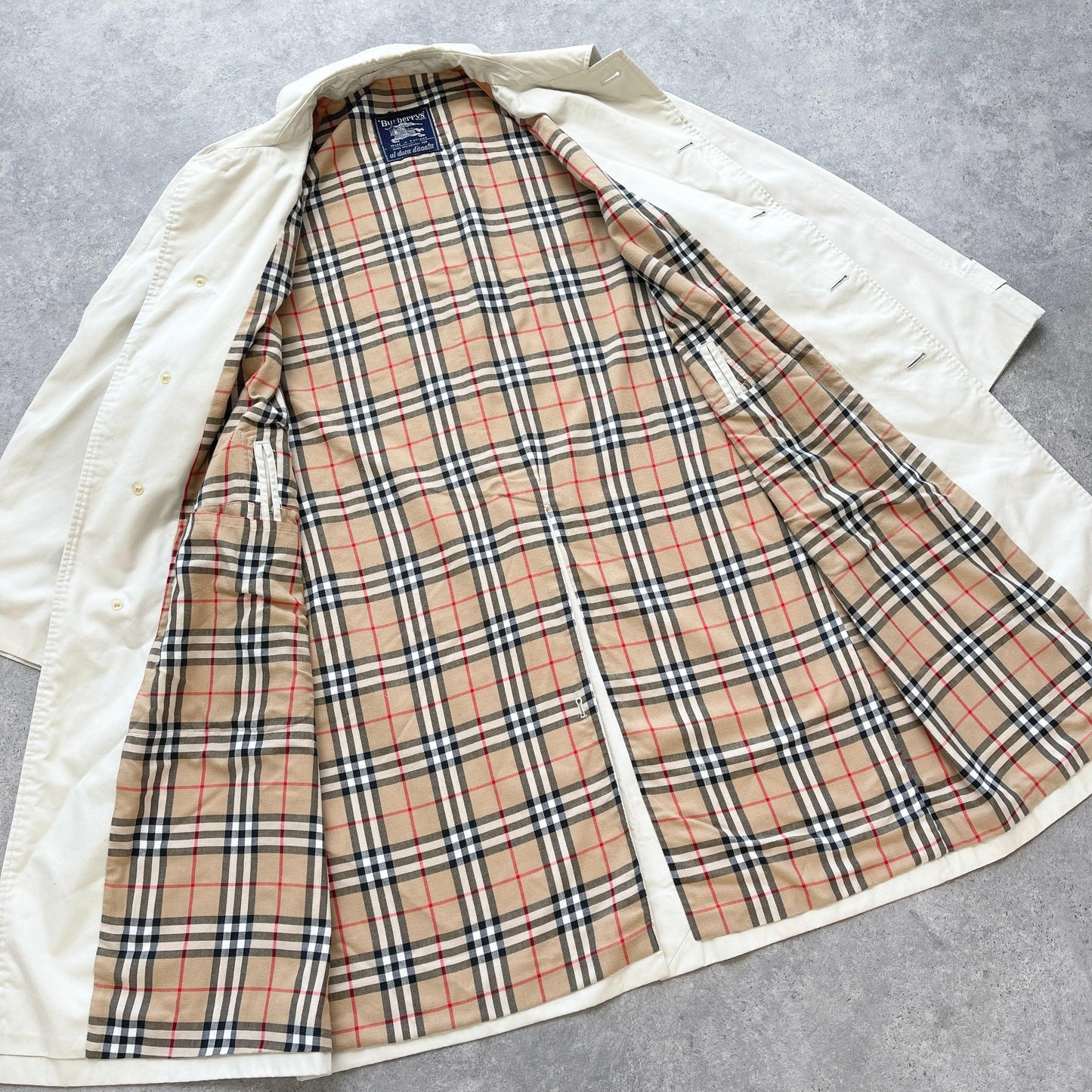 Burberry’s 1990s nova check cream trench jacket (L) - Known Source